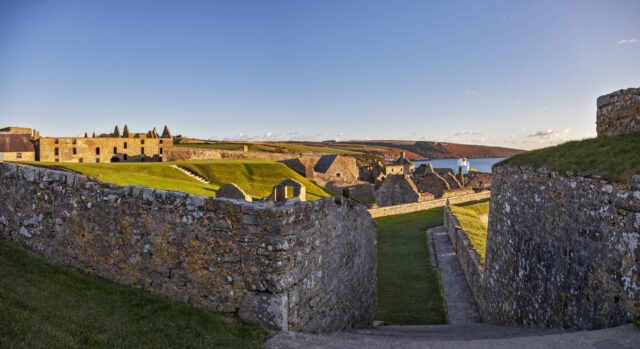 view of the buildings within the magazine fort at sunset